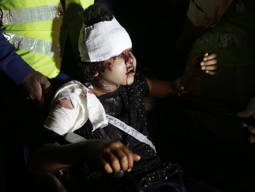 A girl who was injured in a suicide bomb blast is rushed